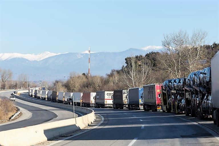 caravan of trucks on road
